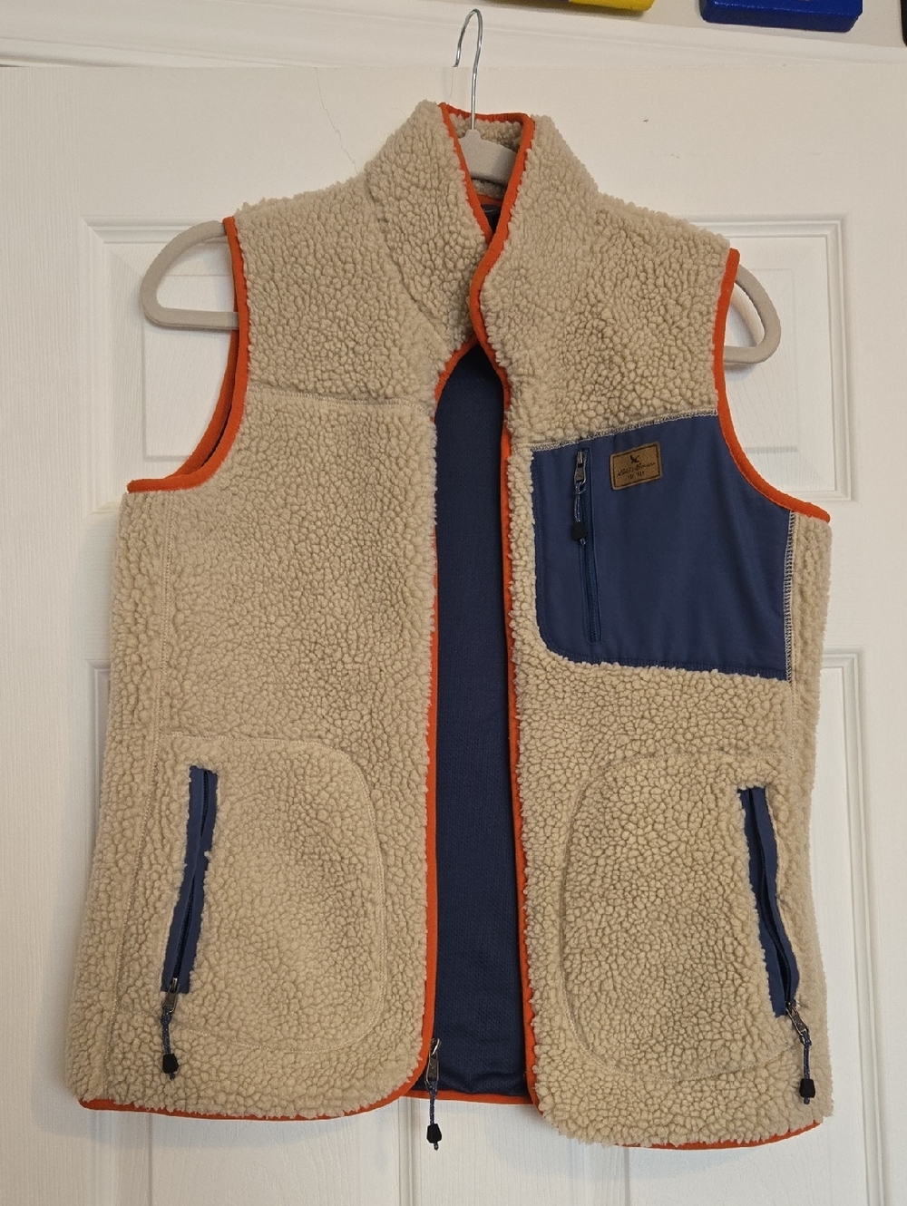Eddie Bauer Cream Sherpa Vest with Navy Pocket and Orange Trim Accents